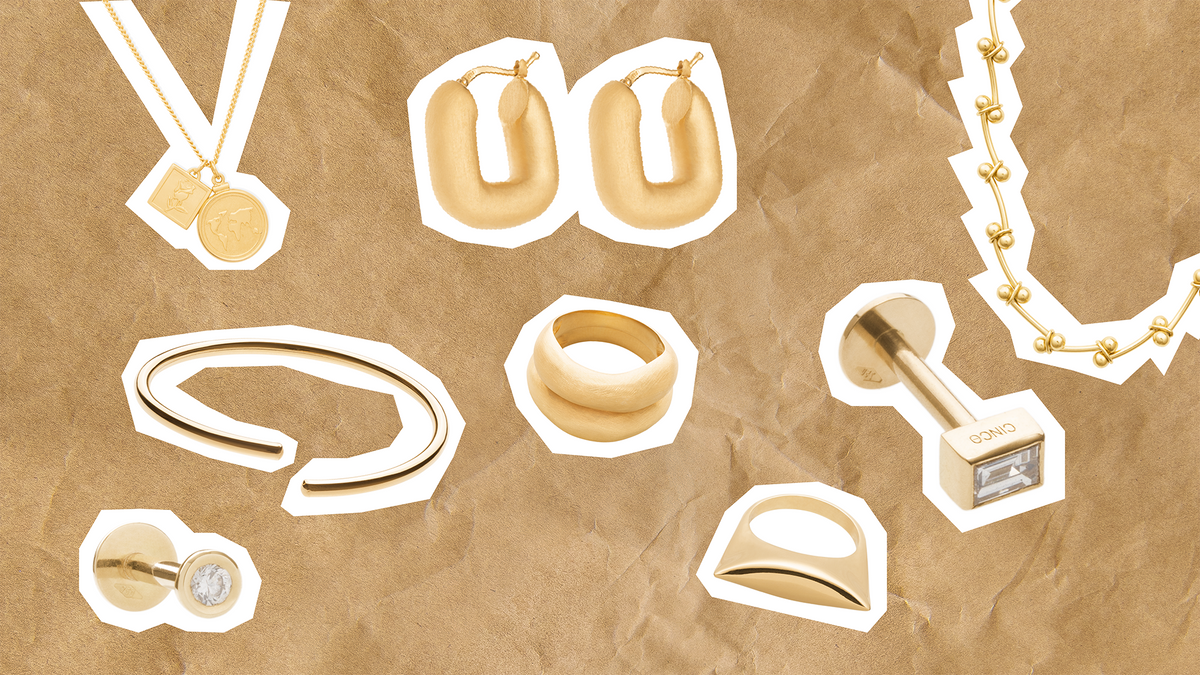 Elevate your wardrobe with jewelry featuring various gold accessories and rings on a textured background.
