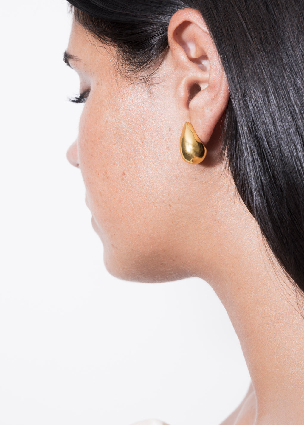 model wearing constantin earrings in gold