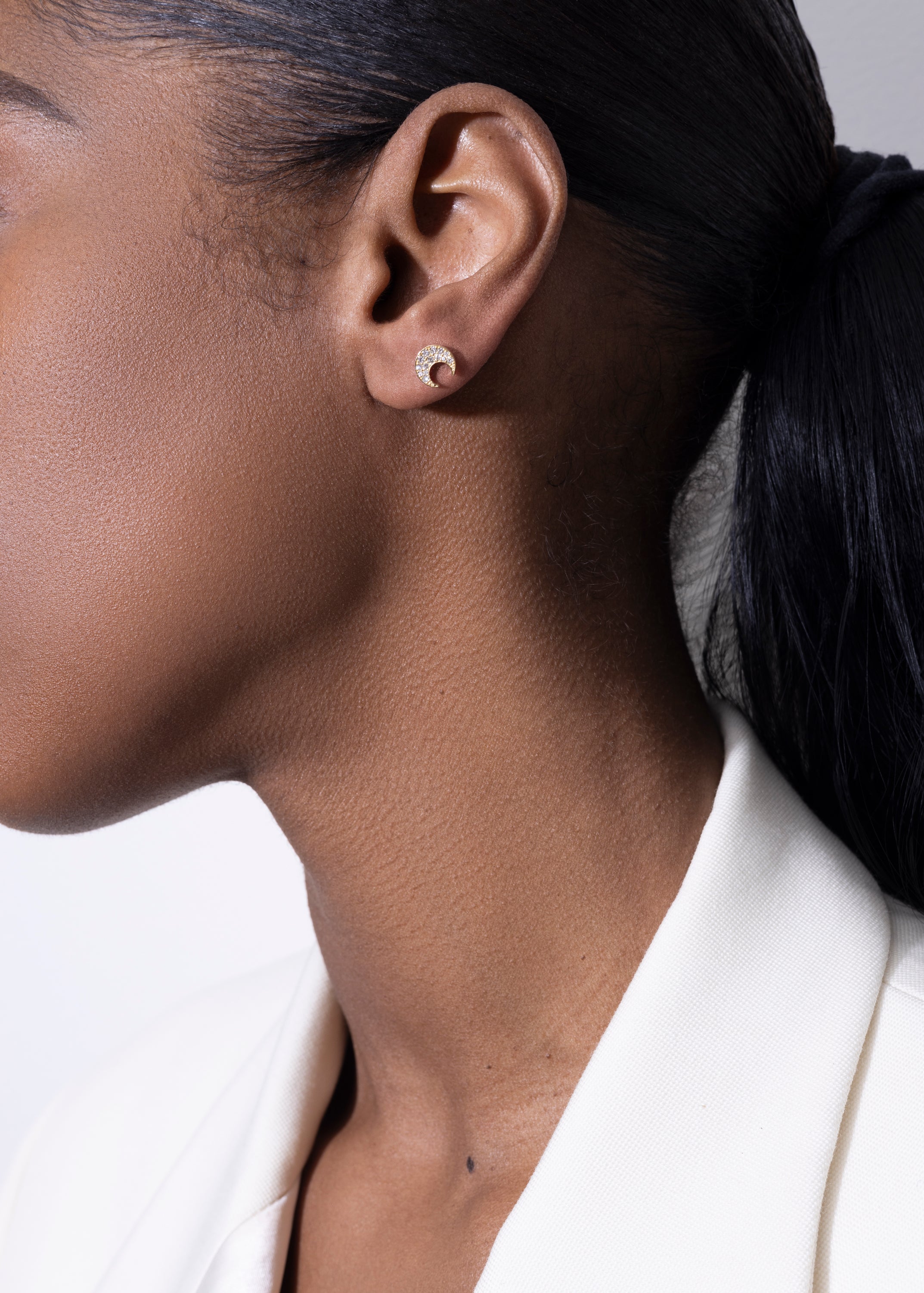 model wearing mush stud 18k diamond