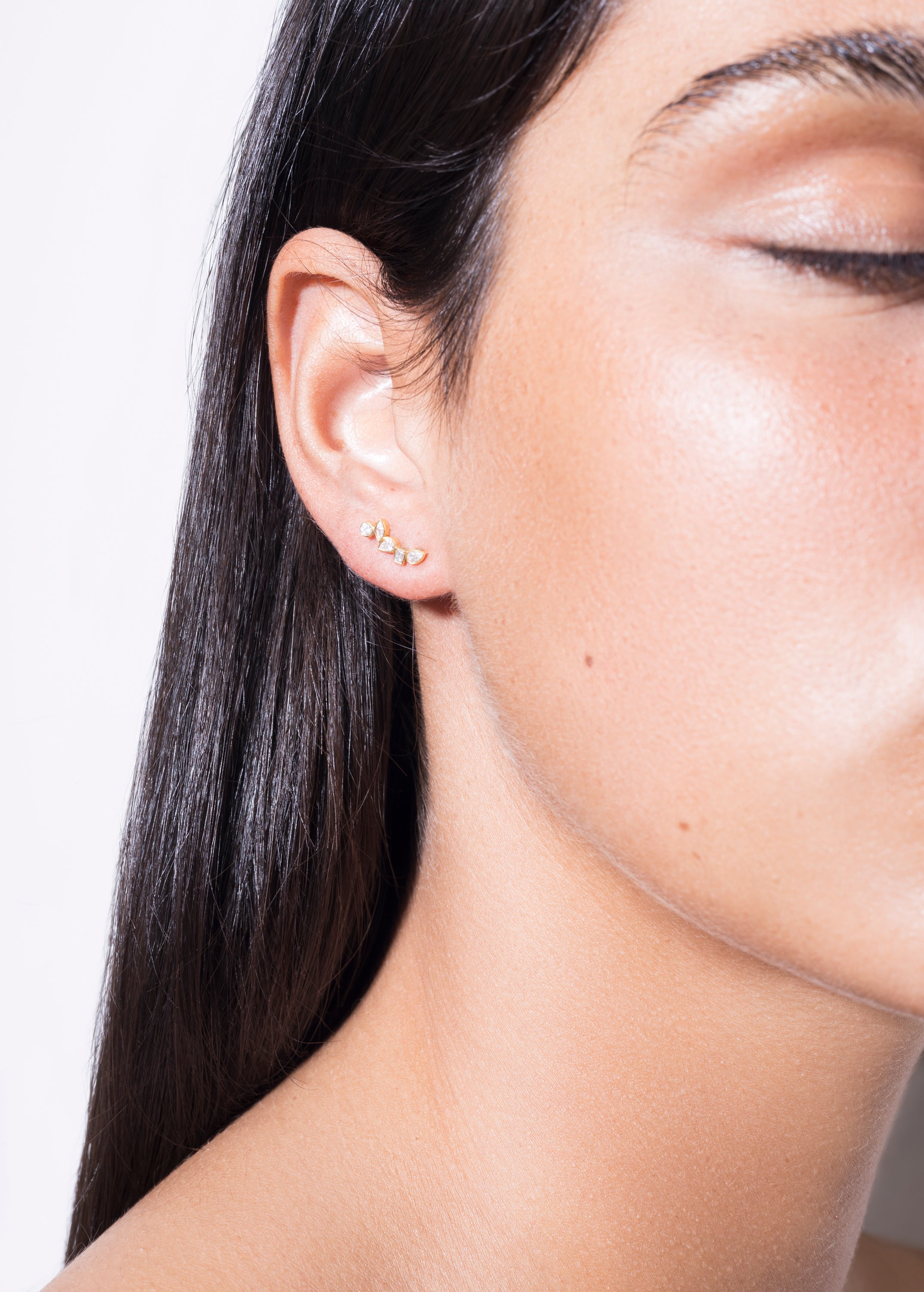 model wearing diamond floating earrings 18k