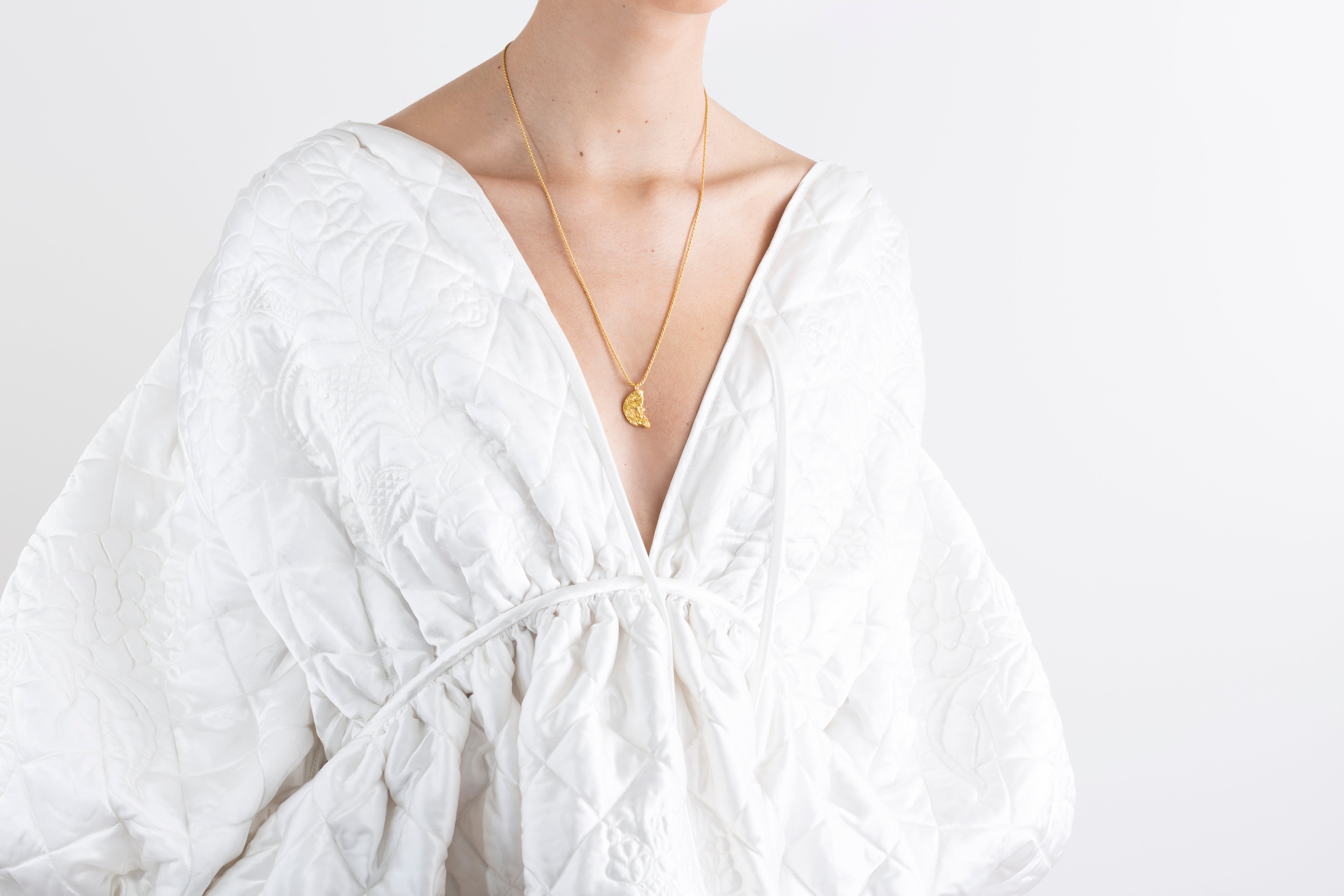 model wearing tilda necklace in gold