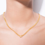 model wearing alphabet necklace with pendant X in gold