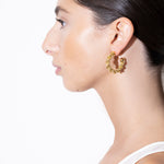 model wearing bia earrings in gold