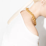 model wearing goliath bia necklace in gold