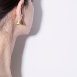 model wearing blake earrings in gold