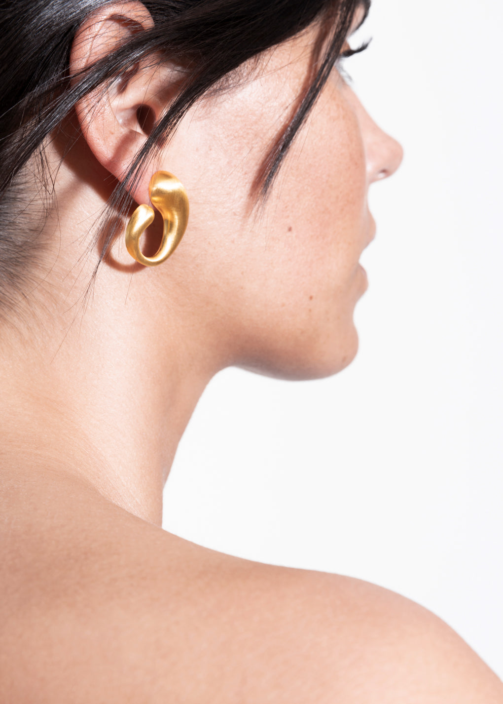 model wearing camille earrings in gold