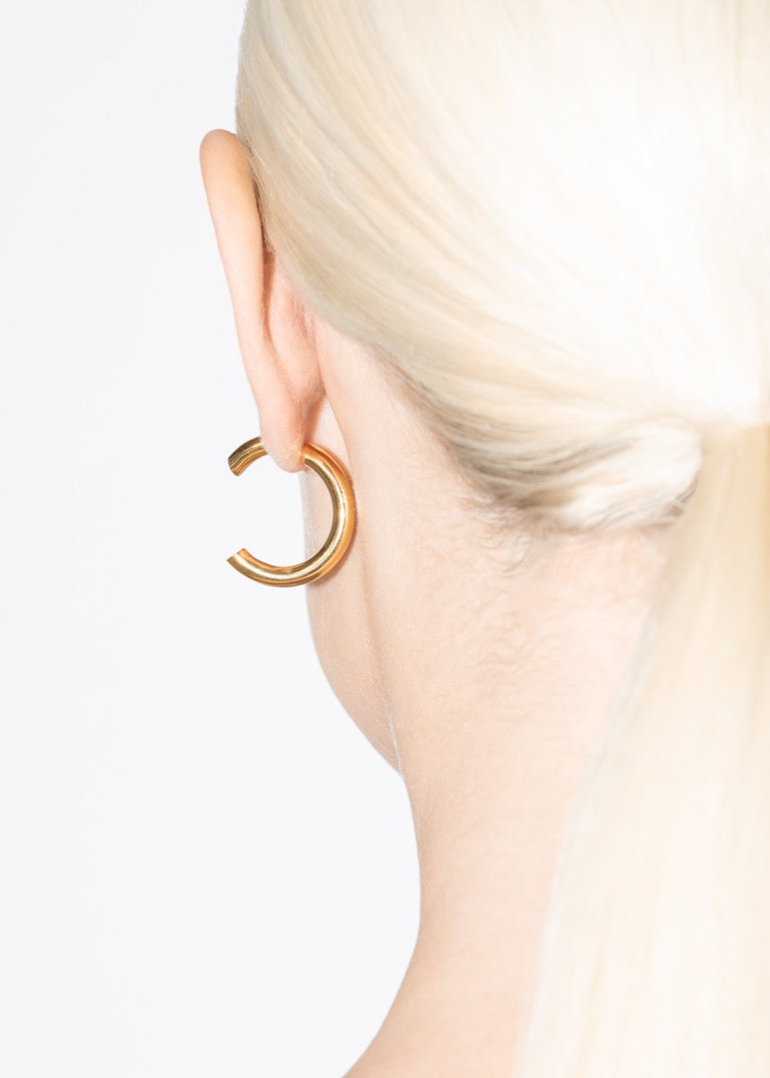 model wearing cat earrings in gold