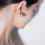 model wearing constantin piercing in gold