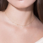 model wearing five lucky diamonds 18k necklace