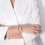 model wearing florence bracelet in gold