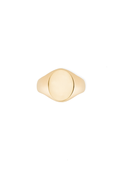 A gold signet ring with a smooth, polished oval face and a tapered band, centered on a plain white background.