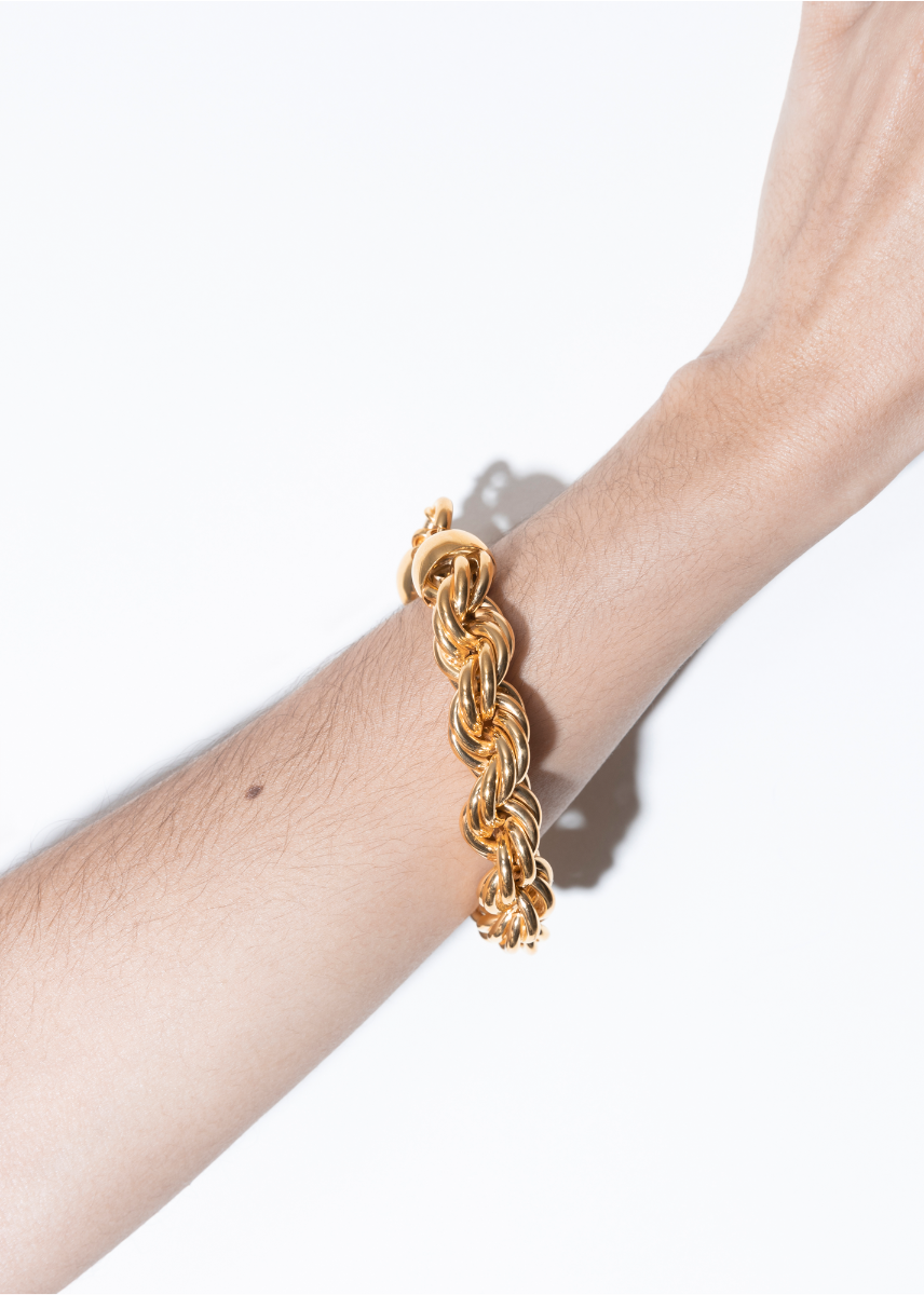 model wearing goliath bracelet in gold