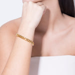 model wearing huda bracelet in gold