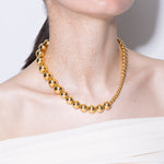 model wearing jackie necklace in gold