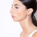 model wearing linda earrings in gold