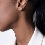 model wearing mush stud 18k diamond