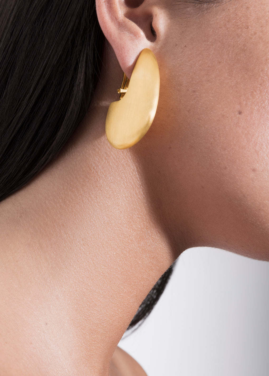 model wearing pam earrings in gold