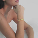 video of model wearing arlo bracelet in gold