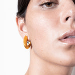 model wearing sarah earrings in gold