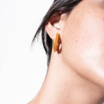 model wearing sarah earrings in gold