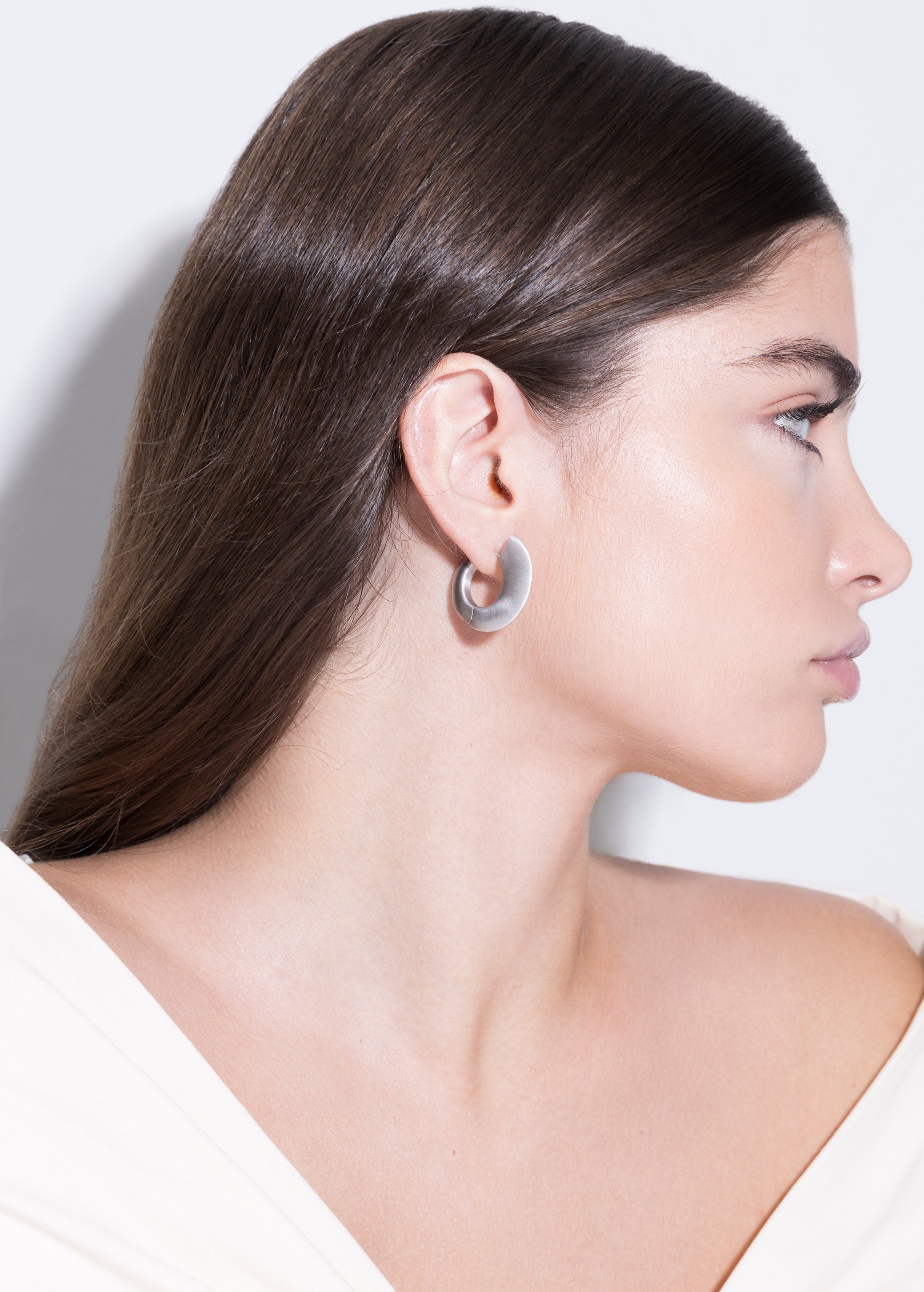 model wearing sarah earrings in silver