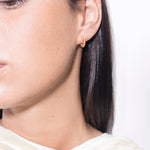 model wearing sarah mini earrings in gold