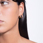 model wearing gaia earrings pink small and gaia earrings pink big in gold