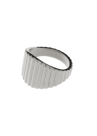 Textured fluted signet ring with a wide domed face and fine vertical grooves, catching light beautifully.