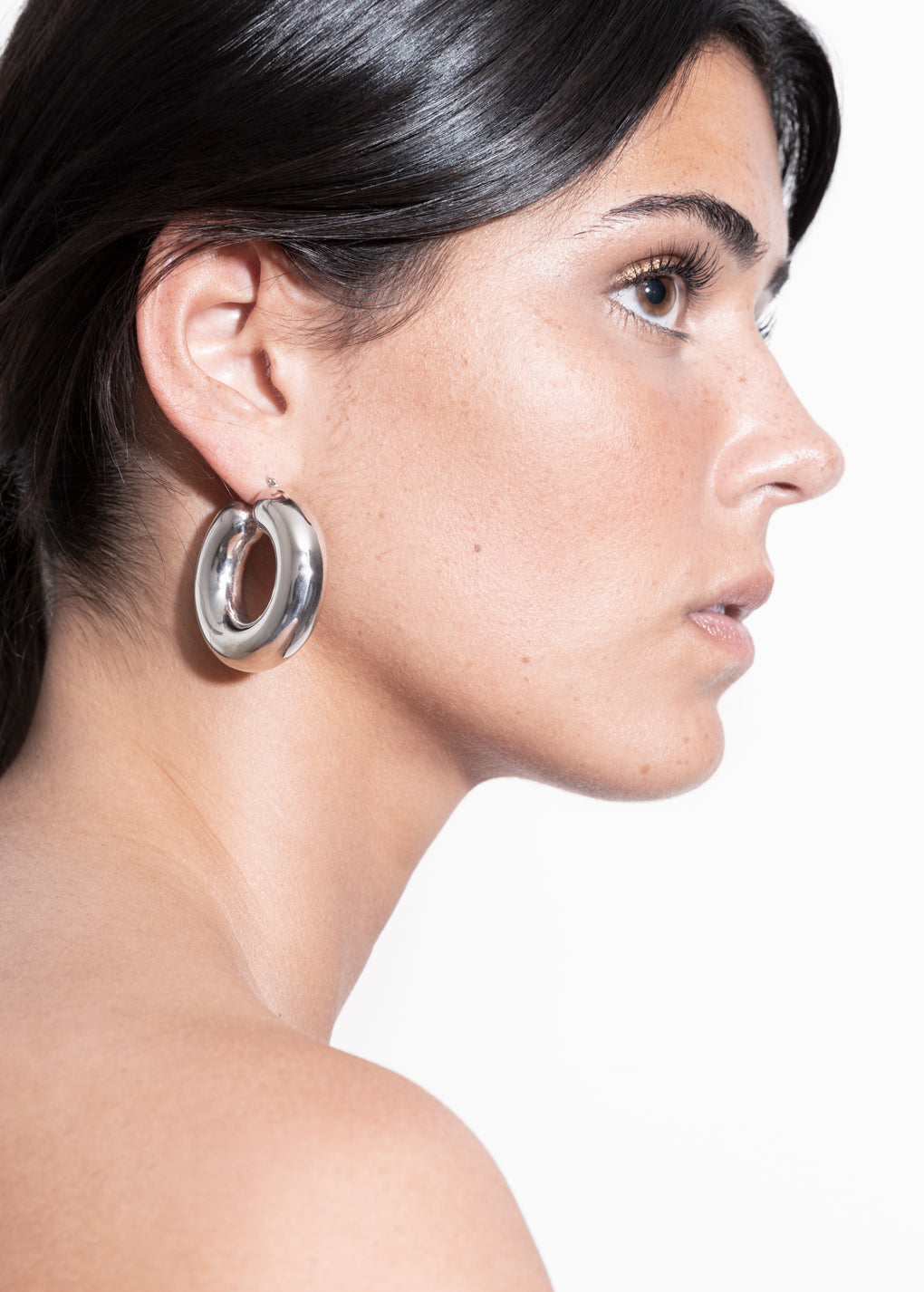 model wearing violet earrings in silver